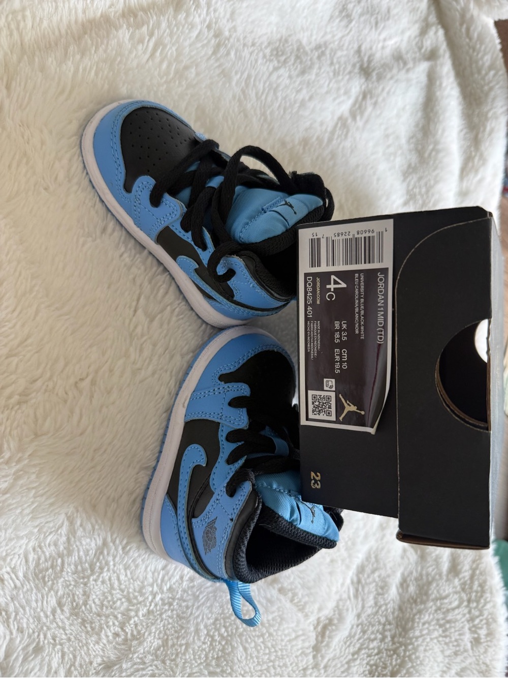 Jordan 1 Kids High-Top Sneakers in Black and Light Blue
